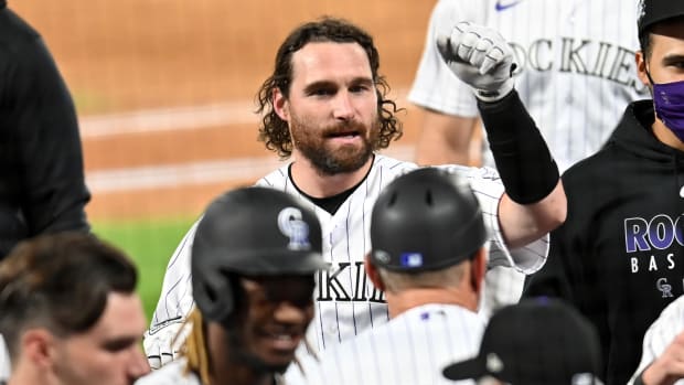Daniel Murphy celebrates with Rockies teammates